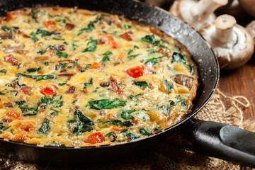 Frittata made of eggs, mushrooms and spinach