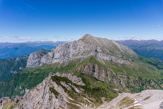 Alpine landscape hiking on the grigne group, one of the most beautiful and famous peaks in Lombardy, Italy - May 2020.