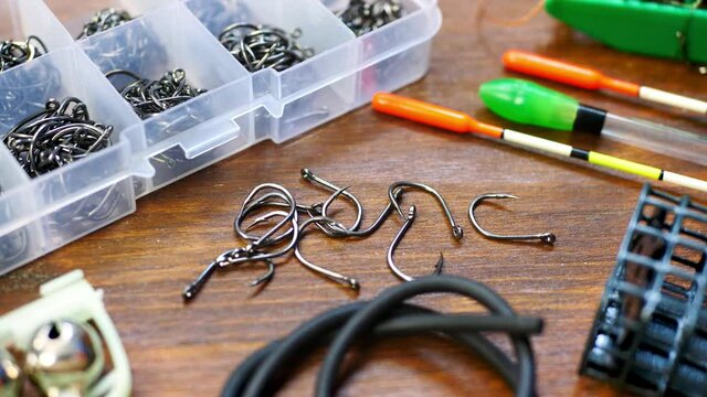 Fishering tackle box filled with hooks, fishing float (or bobber in US), fishing line cord, weight sinker or knoch. Ready for start of fishing season