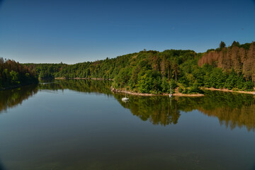  lake motor boat sailboat forest