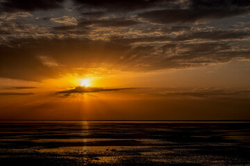 Elton Salt Lake at sunset with beautiful clouds and warm sunny color.