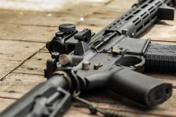 AR15 automatic assault rifle weapon with aim sight and flashlight