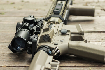 AR15 automatic assault rifle weapon with aim sight and flashlight