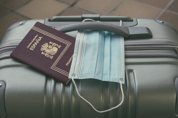 Travel luggage to travel outside of Spain, with a Spanish passport and a health mask, so as not to...