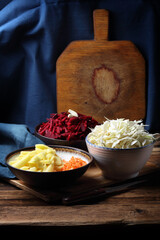 Julienne raw vegetables: potatoes, carrots, cabbage, beets and garlic