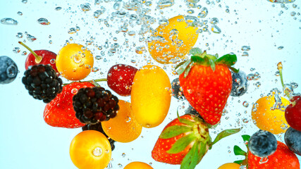 Freeze Motion Shot of Fresh Fruits Falling Into Water Isolated on White Background.