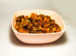 Mango pickle in the plastic bowl