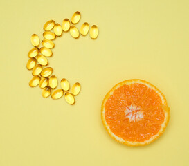 Close Up Of Orange And Pills Isolated - Vitamin Concept