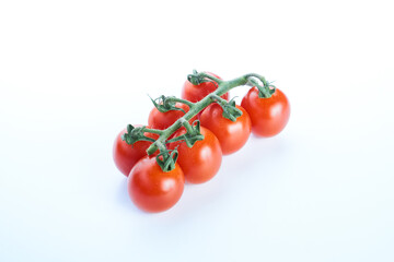Top view of branch tomatoes isolated on white background.