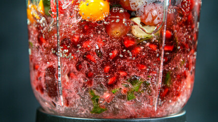 Fresh fruit and vegetables smoothie blended in blender, back view. Healthy eating concept.