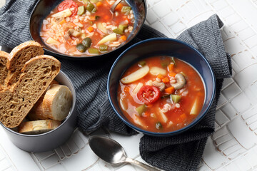 Vegan tomato soup with barley, oyster mushrooms, potatoes, carrots, onions and pickles