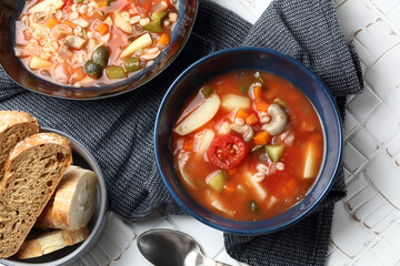 Vegan tomato soup with barley, oyster mushrooms, potatoes, carrots, onions and pickles