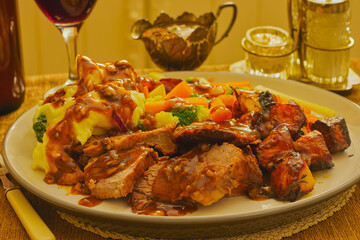 Traditional chicken roast dinner covered in gravy.