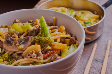 Stir fried beef with noodles and vegetables.