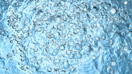 Water surface on blue background, freeze motion