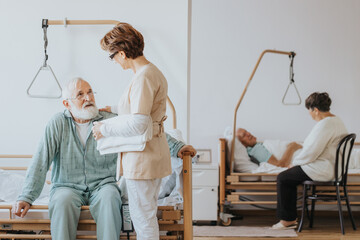 Senior doctor in a beige uniform talks to an elderly patient during a walk around hospital