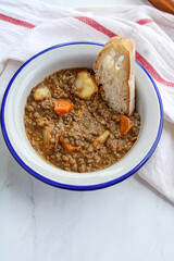 Lentil soup with vegetables and potatoes. Typical Spanish lentil soup. 