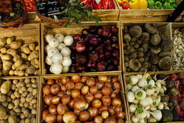 Onion, potato and beetroots in wooden trays