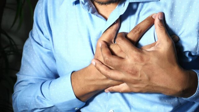 Man having chest pain, heart attack.