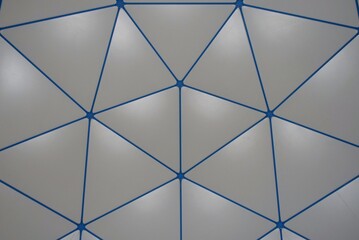 Gray and blue triangular pattern on a roof.