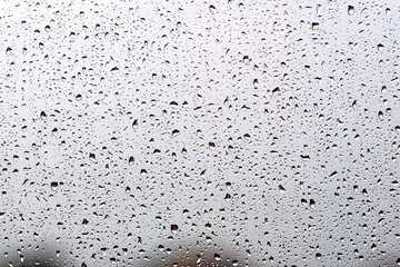 Raindrops on the glass. Water drops background.