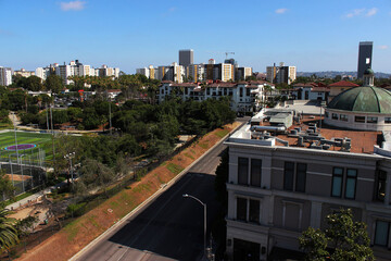 The Groove and Pan Pacific Park are a great place to stay in Los Angeles. Top view of the walking area with sidewalks, cafes and sports fields with a panorama of the residential complex La Brea.