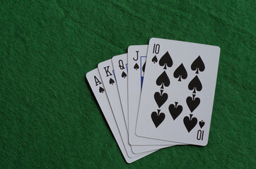 Playing cards: A poker Royal Flush in spades.