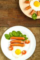 Scrambled eggs with sausages in the shape of the sun and the usual adult and children's breakfast.