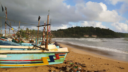 Fishing boat at beach side in the evening.Beach with fishing boat.