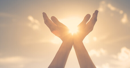 Hands in the sky holding the sun light. Gratitude,, hope, and worship concept. 
