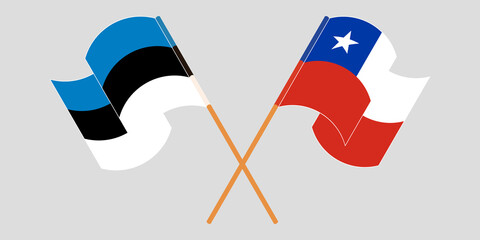 Crossed and waving flags of Chile and Estonia