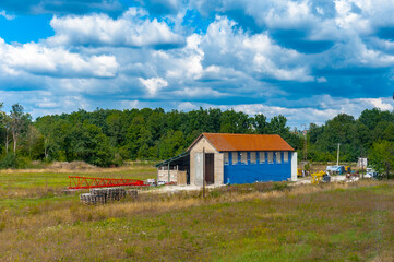 It's Blue farm on the green grass