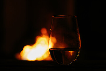 A glass with fire on a background 