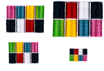 a set of multicolored bobbins threads for sewing on different scales isolated on a white background