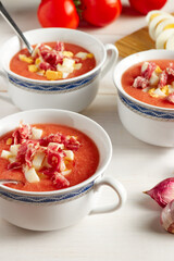 Tomato soup, salmorejo, with raw ingredients on a table