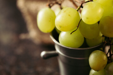 Bunch of green grapes on a dark background. Organic food.