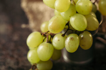 Bunch of green grapes on a dark background. Organic food.