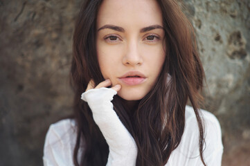 Beautiful brunette woman on the beach