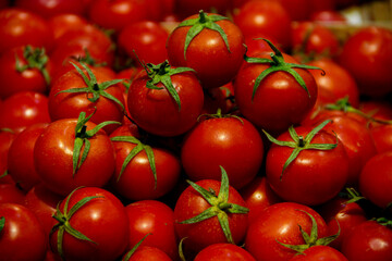 Fresh cherry tomatoes with green leaves