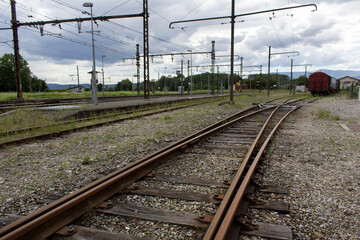 Fototapeta na wymiar Railway road countryside landscape with cargo train on horizon commerce industrial transport concept 
