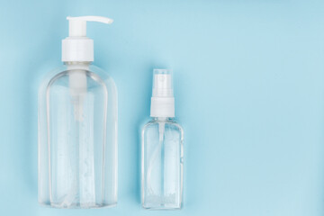 Antiseptic on blue background. Hand sanitizer.