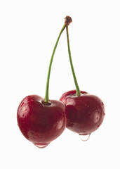 Red berry cherry with raindrops on white background.