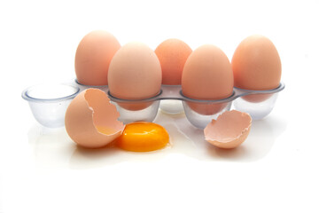 Fresh Eggs in the refrigerator tray. Six homemade eggs. White background. isolate.