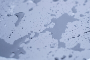drops of pod on frosted glass