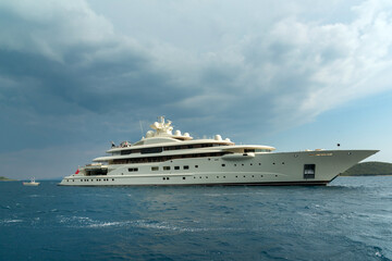 Fototapeta na wymiar Luxury super yacht passing Korcula island in Adriatic, Croatia