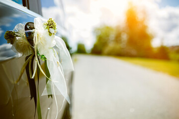 Wedding car decorated with flowers.