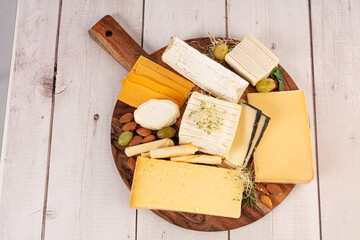 Assorted cheeses on a board