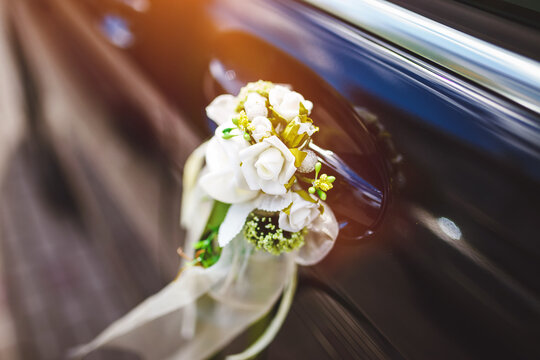 Wedding car decorated with flowers.
