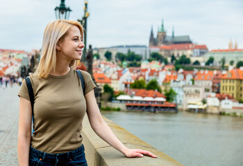 Blonde woman at Charles bridge in Prague, Czech Republic