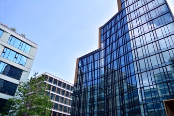 Facade texture of a glass mirrored office building. Fragment of the facade. Modern architecture of the office building.